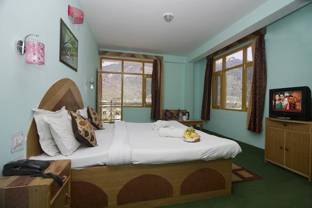 Hotel Ocean Inn Manāli Quarto foto